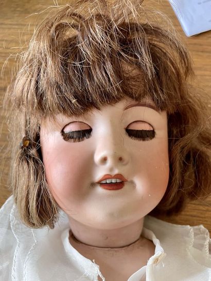 null Doll, head in porcelain cookie, mouth open on a row of teeth, mobile eyes


Marked...