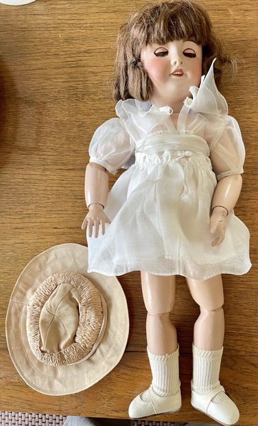 null Doll, head in porcelain cookie, mouth open on a row of teeth, mobile eyes


Marked...