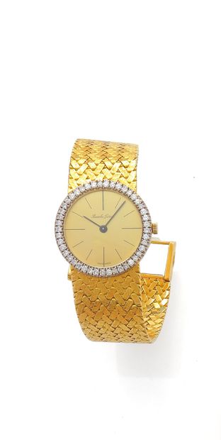 null BUECHE-GIROD
Montre bracelet de dame en or jaune et or gris 18k (750 millièmes),...