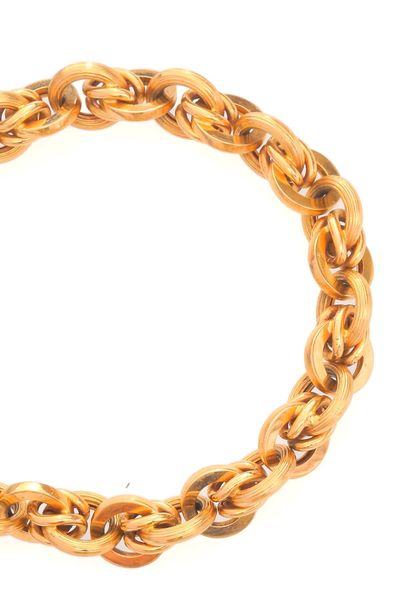 null Bracelet en or jaune 18k (750 millièmes), formé d'une maille jaseron en partie...