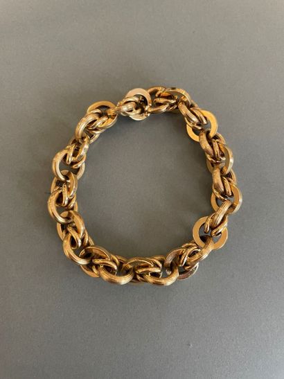 null Bracelet en or jaune 18k (750 millièmes), formé d'une maille jaseron en partie...