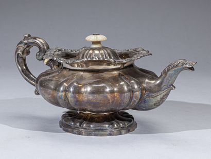 Important silver teapot with flattened body...