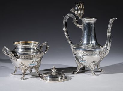 null A baluster-shaped silver coffee and sugar pot, decorated in the middle with...
