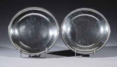 Pair of small round silver dishes with palmettes...
