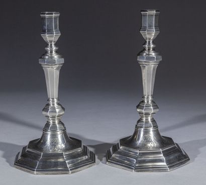 null Pair of octagonal silver torches, the base with steps and doucine armorié, the...