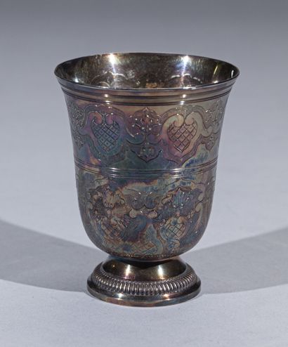 null Silver tulip tumbler engraved on two registers of cartouches, foliage and acanthus...