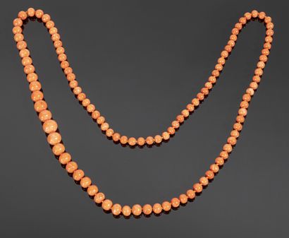 Long necklace of coral pearls in fall (diameters:...