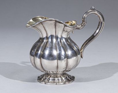 null Baluster milk jug on a pedestal, the body with large sides in silver with gadroon...
