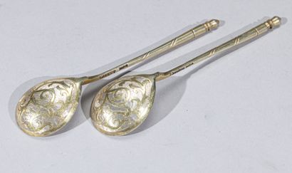 null Two small spoons in vermeil, with a column handle, the spoon engraved externally...