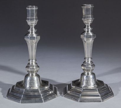 null Pair of octagonal silver torches, the base with steps and doucine with the coat...