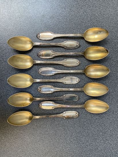 null Set of twelve silver and vermeil dessert spoons and forks, with chased foliage...