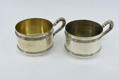 Pair of large silver cups chased with ribboned...
