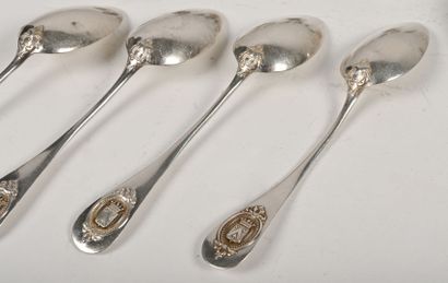 null Set of four silver flatware, chased with a coat of arms "Gules with a golden...