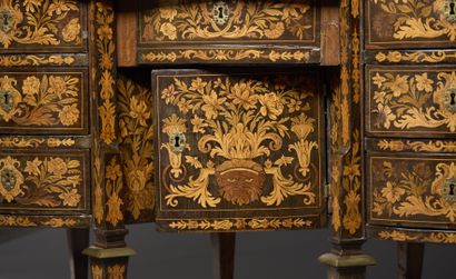 null @ Mazarin-shaped eight-legged desk in marquetry on an ebony base, the front...