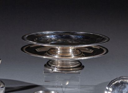 @ Pair of circular display stands on silver...