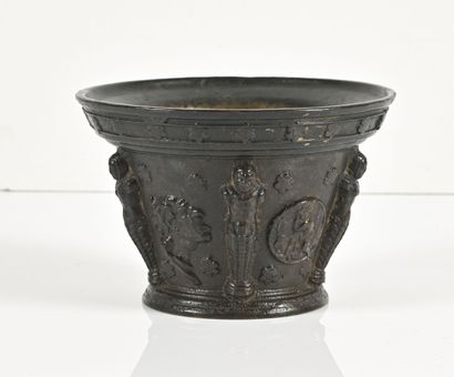 null @ Apothecary's mortar in bronze with alternating medallions showing a figure...