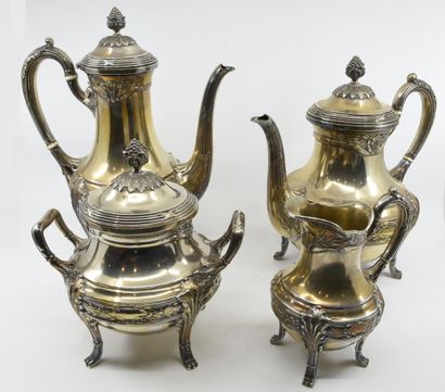 null Part of a four-piece silver tea and coffee service chased with foliage and garlands,...