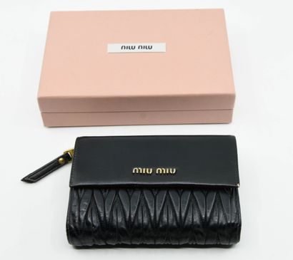 null MIU MIU
Black pleated leather wallet with snap closure and zippered purse. 
H....