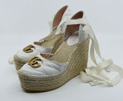 GUCCI
Pair of white quilted leather pumps...