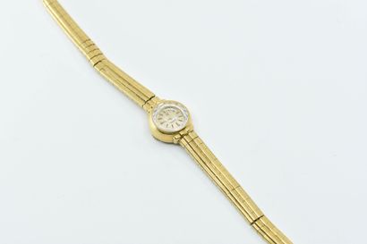 null OMEGA
Petite montre de dame en or jaune 18K (750°/°°), cadran fond ivoire, bracelet...