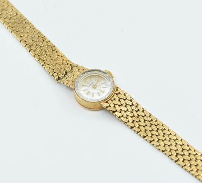 null FLAMOR
Petite montre de dame en or jaune 18K (750°/°°), cadran nacré, bracelet...