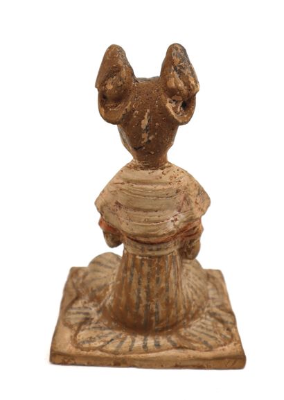null China, 20th century
Han style terracotta statuette of a female musician, seated...