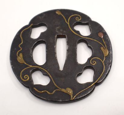 null Japan, 19th century 
Iron Tsuba (sword guard) decorated with four inome (boar's...