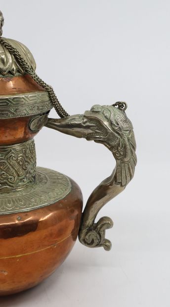 null Tibet, late 19th/early 20th century
Copper and silver jug (low title) decorated...