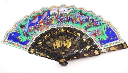 null CHINA, Canton - 19th century
Black and gold lacquered wood fan with gouache...