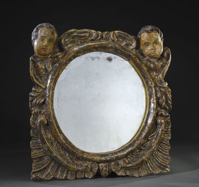 Grand miroir rond en bois argenté à décor...