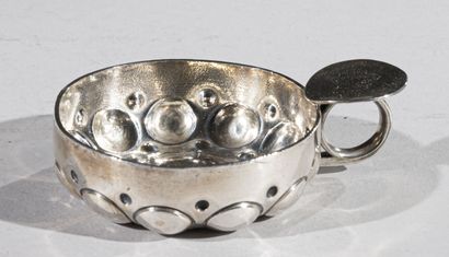 Silver wine tasting cup, decorated with cupules...