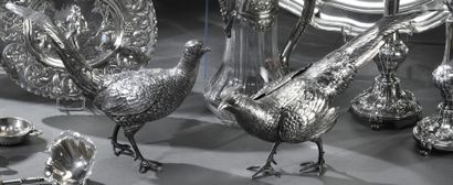 Pheasant pair in chased silver, the wings...