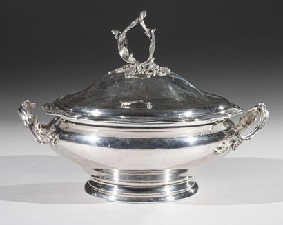 Round covered vegetable dish on a silver...