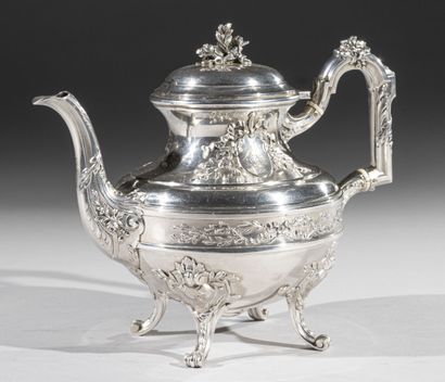 Circular silver teapot decorated with a reserve...