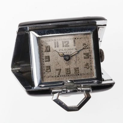 M. Plojoux Genève. Vers 1930 Petite montre de voyage en acier et bakélite. Le cadran...