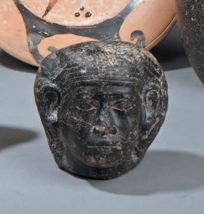 Tête masculine portant un némès strié
Diorite
Égypte,...