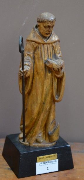 null Statuette de Saint Augustin (?) en bois sculpté redoré tenant un livre et une...