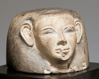 null Bouchon de vase canope à tête anthropomorphe, le némès est peint en noir
Calcaire
Égypte,...