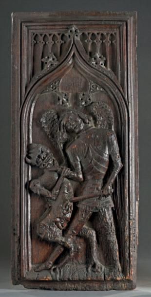 null Panneau en bois sculpté représentant saint Michel
XVIe siècle
H. 85 cm - L....