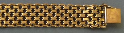 null Bracelet ruban en or jaune 18K (750/°°) à maillons articulés
Poids brut 29,2...