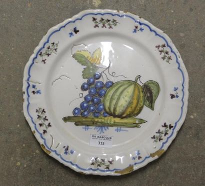 null CENTRE ou Italie, début du XIXe siècle

Assiette à décor d'un melon et de fruits

D....