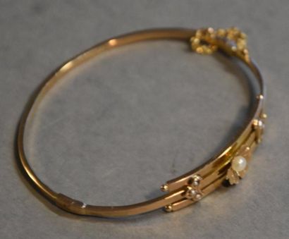 Bijoux - Joaillerie Petit bracelet rigide en or jaune 18K (750/°°) à décor de fleur...