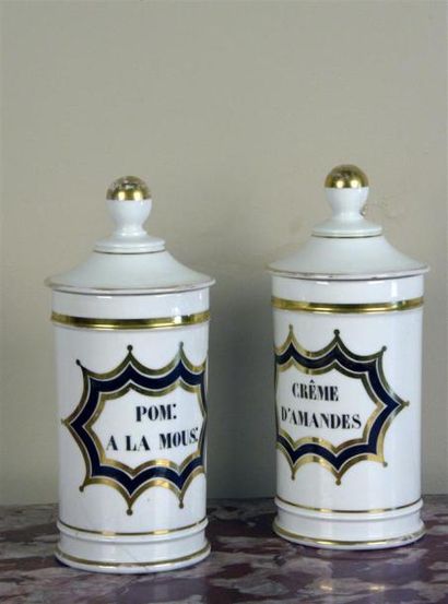null ** Paire de pots à pharmacie cylindriques couverts en porcelaine, marqués «Crème...