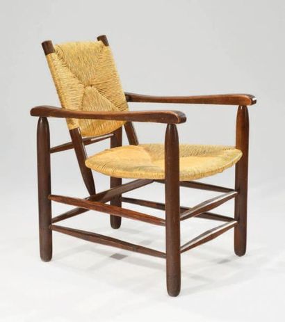 Charlotte PERRIAND (1903-1999) Fauteuil dit «Paillé», piétement et structure en bois...