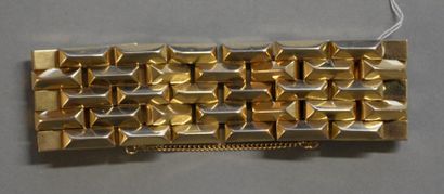 null 
Bracelet en or jaune 18K (750/°°) à maillons géométriques articulés.


1940


Poids...