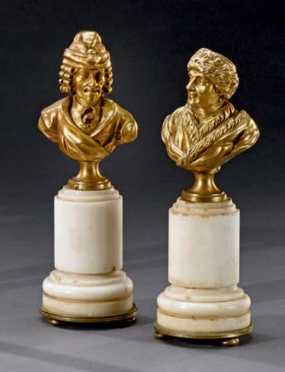 null Deux bustes en bronze doré formant pendant représentant
Voltaire et Rousseau
Socle...
