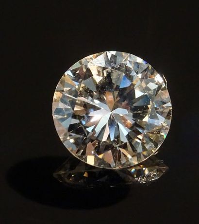 null Bague solitaire en or gris 18K (750/°°) sertie d'un diamant taille brillant...
