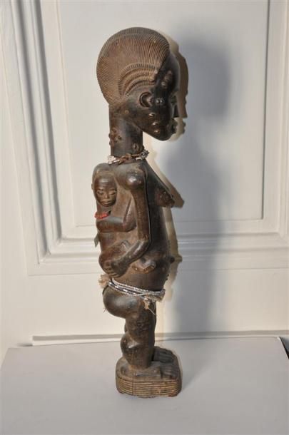 null BAOULE - COTE D'IVOIRE Statuette Biolobia en bois sculpté patiné figurant une...