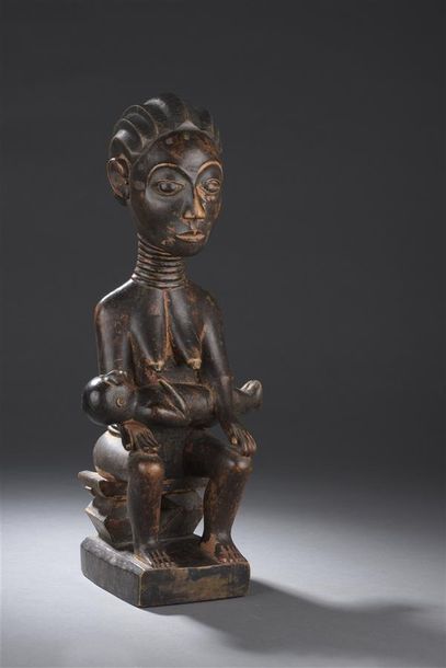 Arts africains Statue de femme avec enfant Bois patiné H. 41,5 cm