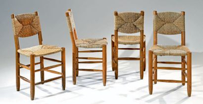 Charlotte PERRIAND (1903-1999) Suite de quatre chaises n°19, structure en bois naturelle,...